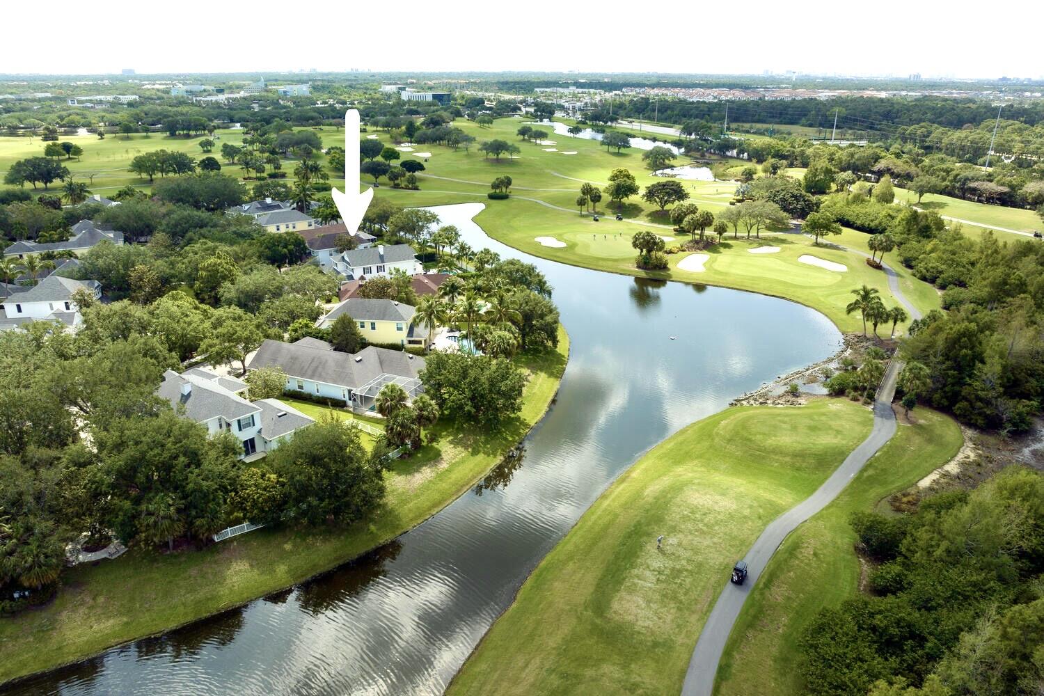 244 Barbados Drive Jupiter, FL 33458 - Photo 34 of 51 a view of a lake with a city