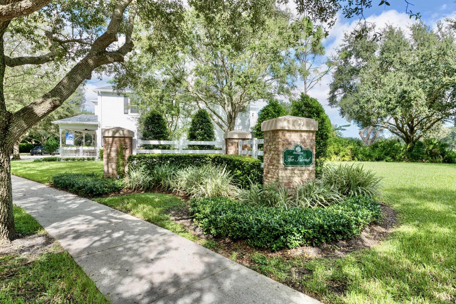 244 Barbados Drive Jupiter, FL 33458 - Photo 43 of 51 a front view of a house with a yard and fountain in middle