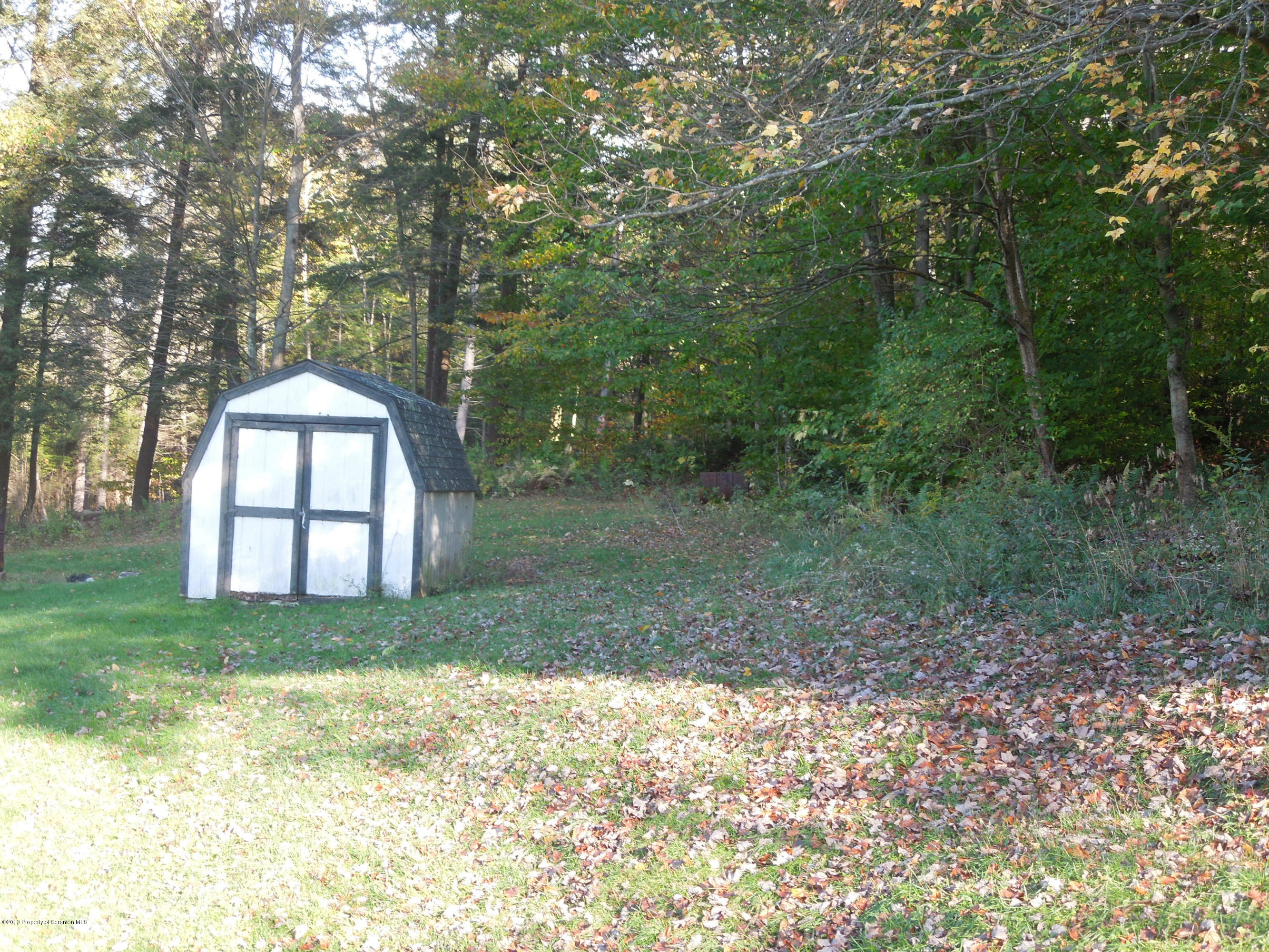 930 West Avery Station Road Factoryville, PA 18419 - Photo 12 of 12 a big yard with large trees and a small yard
