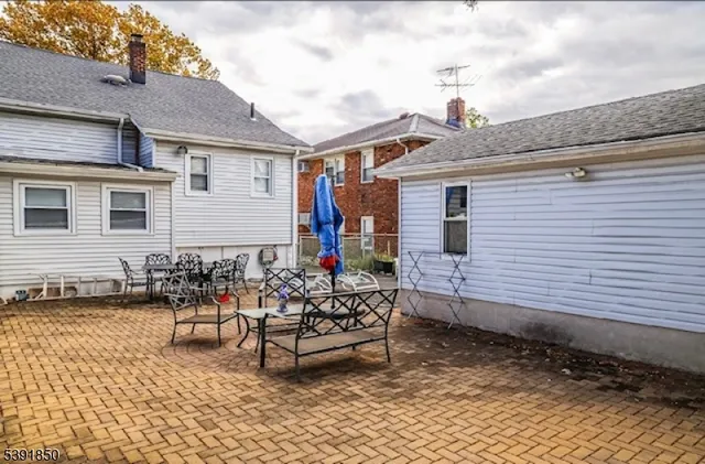 a dining room with furniture window and wooden floor