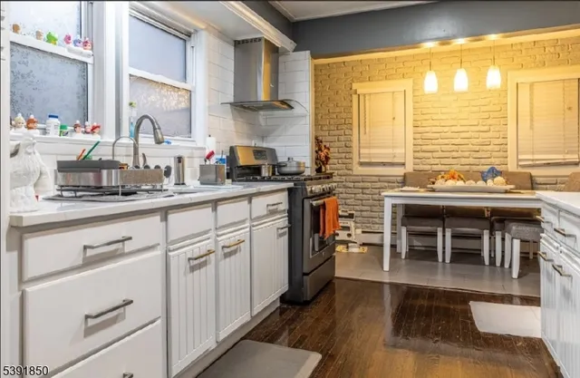 a white toilet sitting next to a bathroom sink
