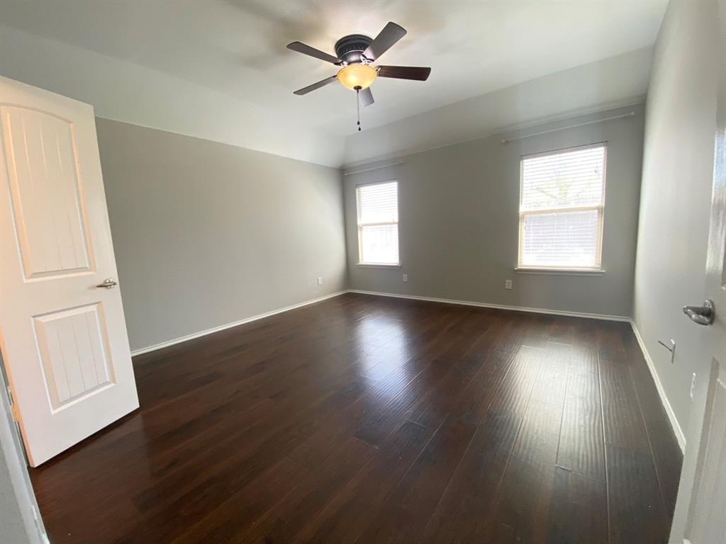 9717 Mystic Dunes Drive McKinney, TX 75072 - Photo 10 of 16 a view of room with window ceiling fan and hardwood floor
