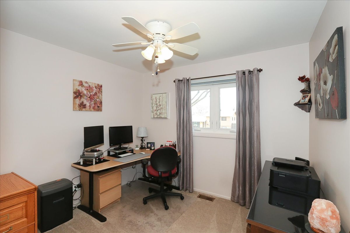 1335 Gentry Road Hoffman Estates, IL 60169 - Photo 18 of 33 a view of a workspace with furniture and a window