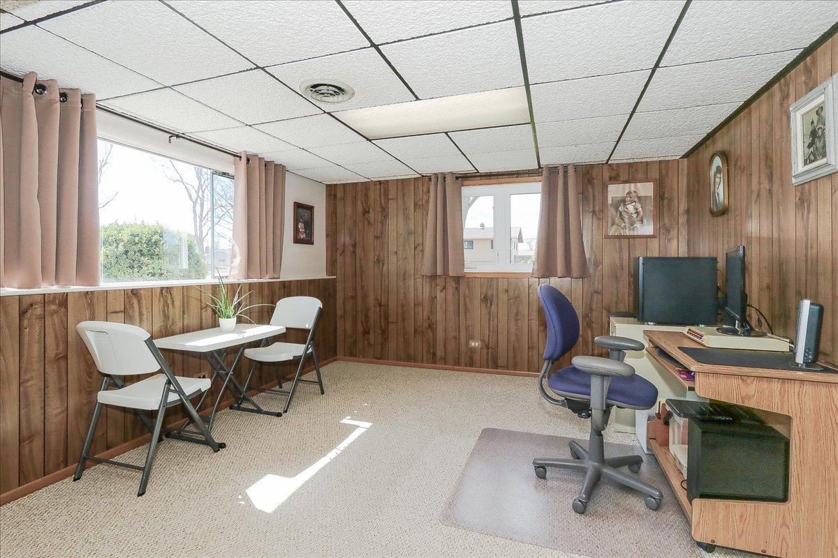 1335 Gentry Road Hoffman Estates, IL 60169 - Photo 23 of 33 a workspace with furniture a chandelier and window