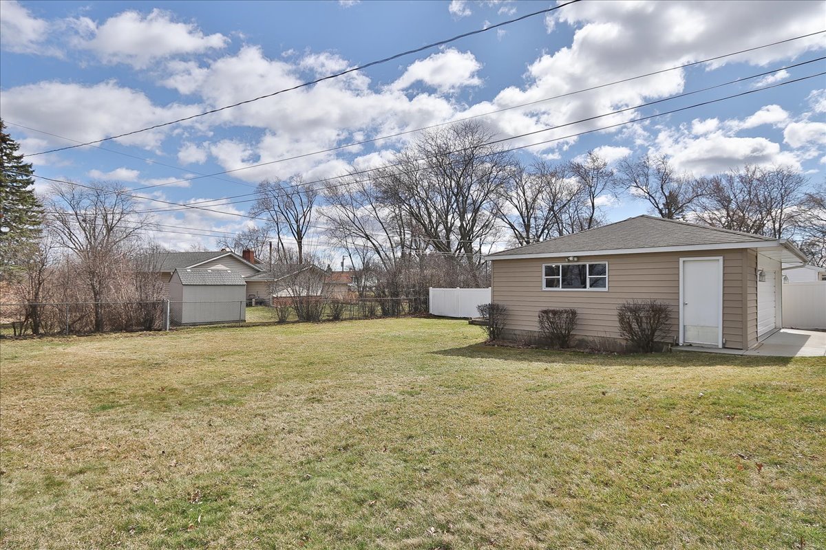 1335 Gentry Road Hoffman Estates, IL 60169 - Photo 30 of 33 a view of a house with a yard