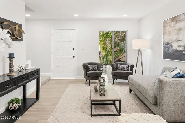 a living room with furniture and a window