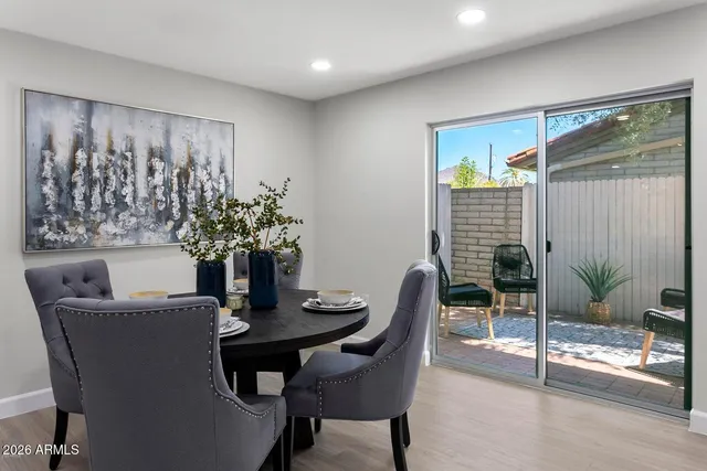 a dining room with furniture and window