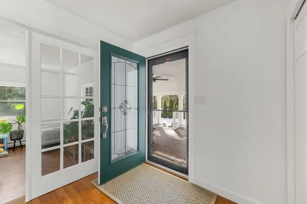 a kitchen with stainless steel appliances kitchen island granite countertop a refrigerator stove top oven and sink