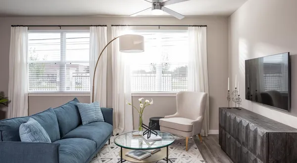 a living room with furniture and a large window