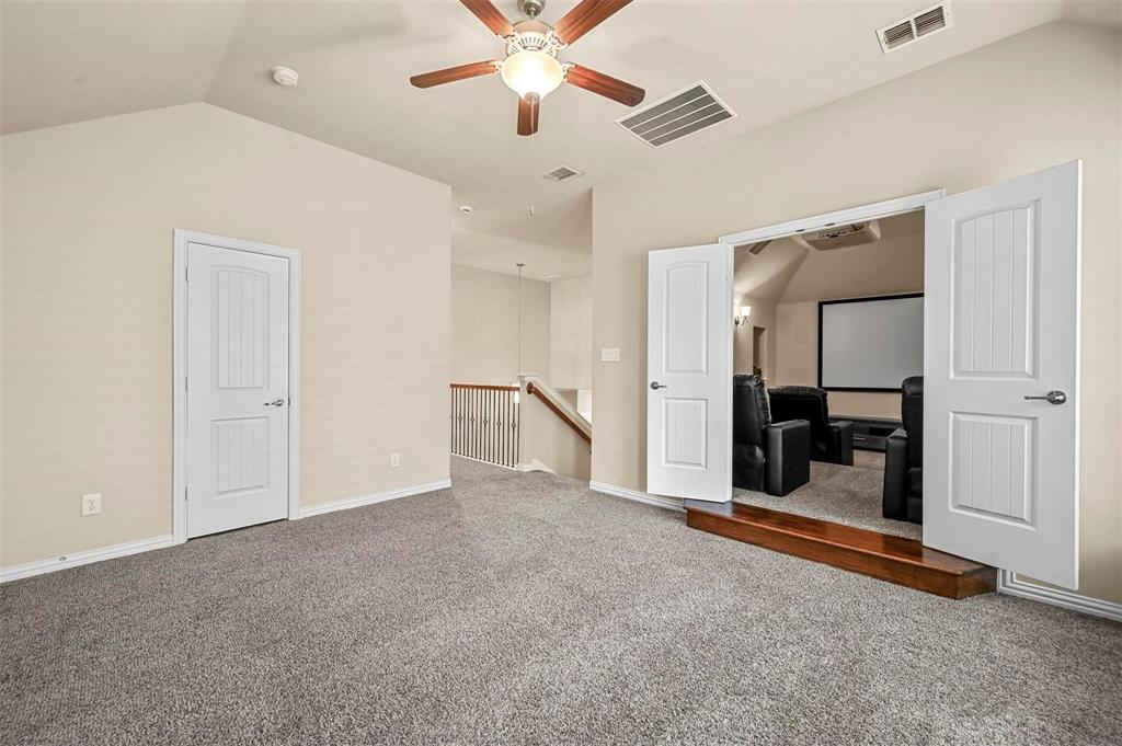 602 Whitetail Road Euless, TX 76039 - Photo 19 of 28 a view of an empty room with a ceiling fan
