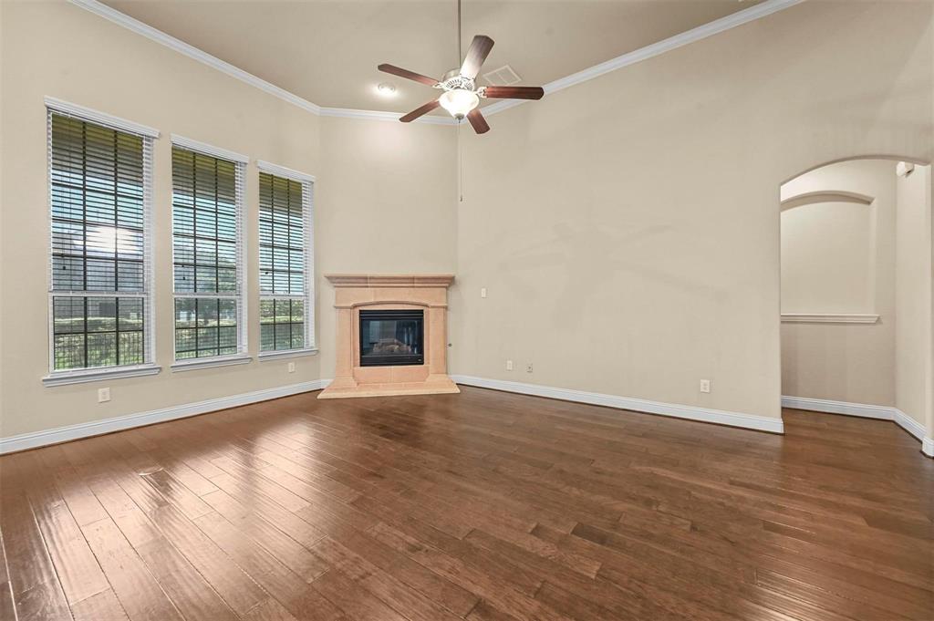 602 Whitetail Road Euless, TX 76039 - Photo 10 of 28 a view of an empty room with wooden floor and a window