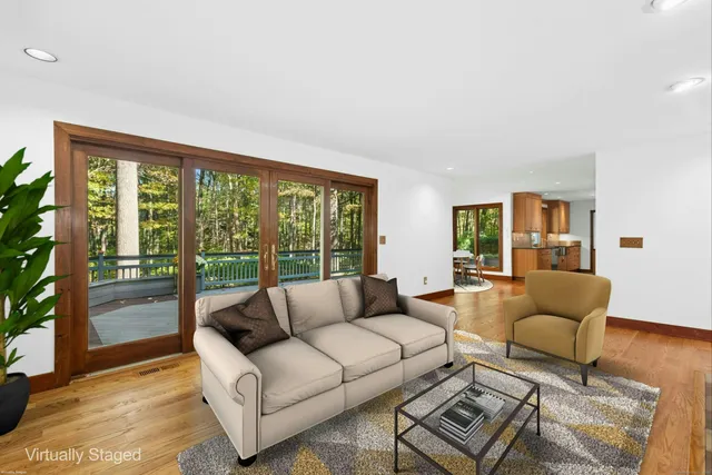 a living room with furniture and a large window