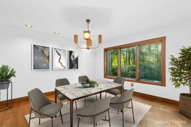 a dining room with furniture and window
