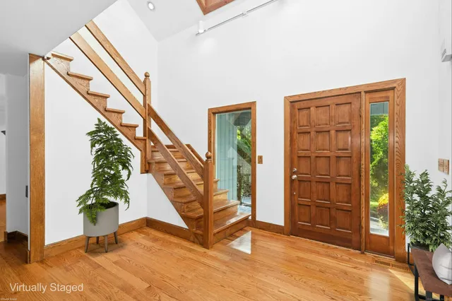 a view of an entryway with hardwood
