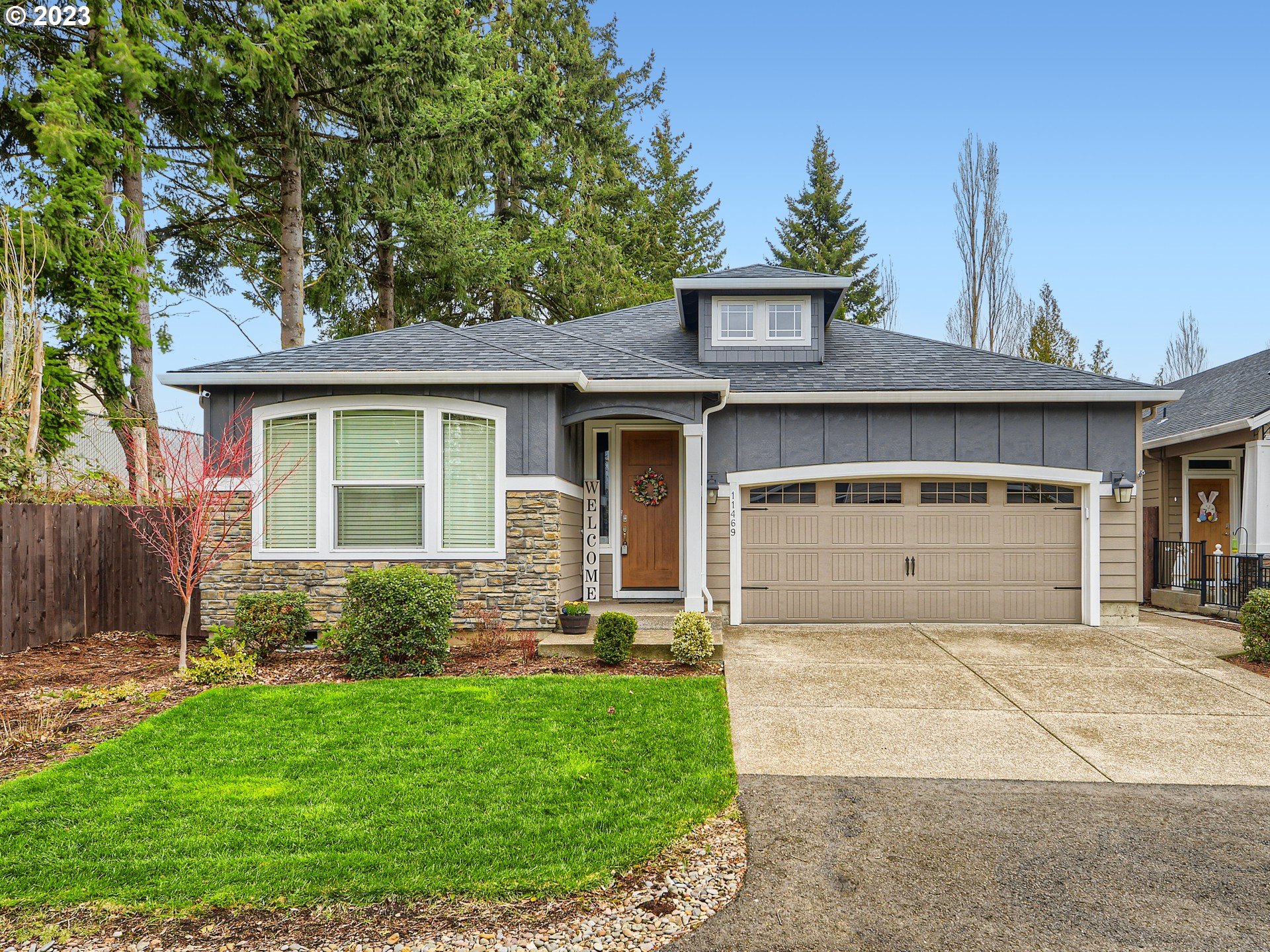 a front view of a house with garden