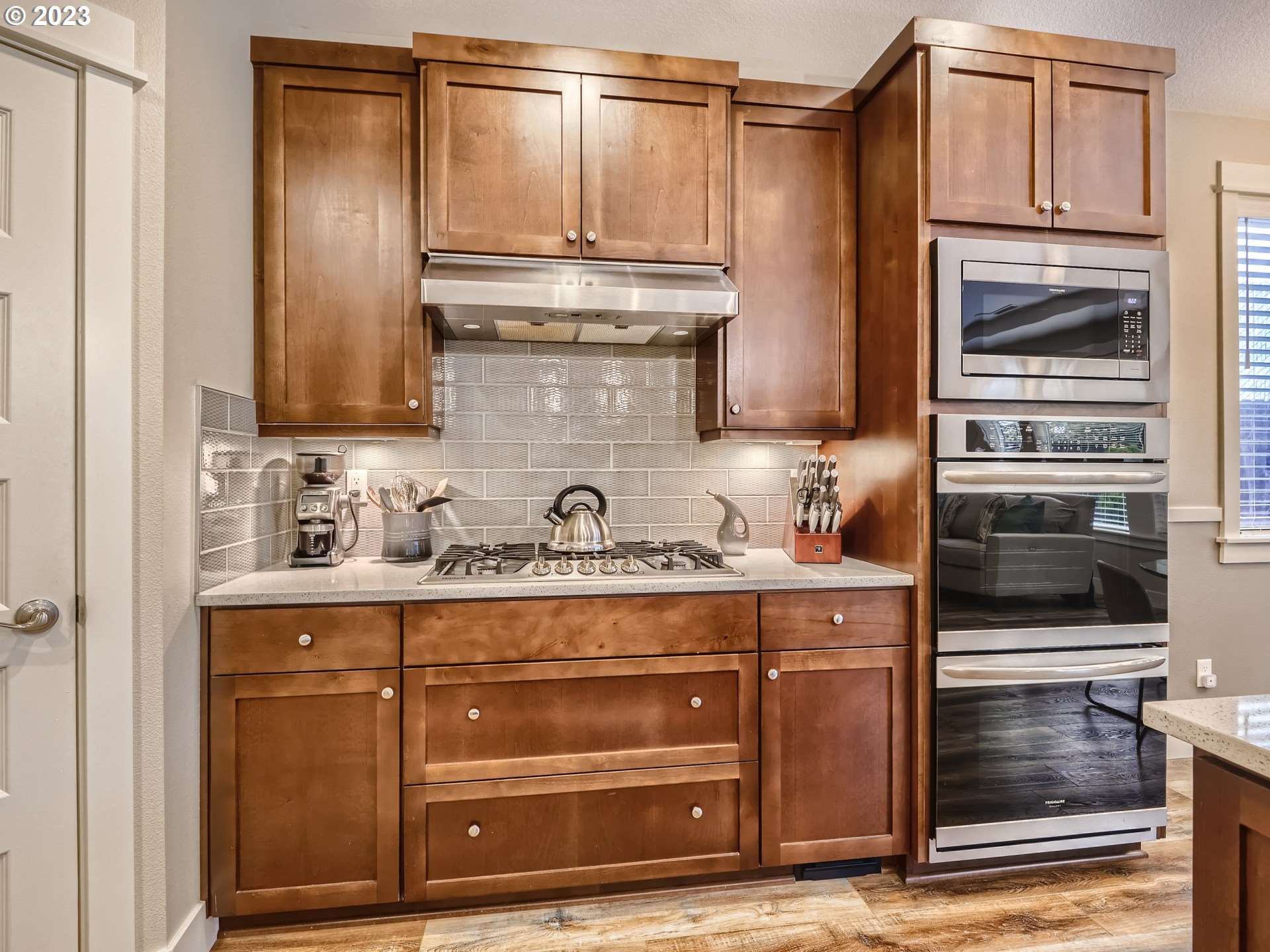 11469 Southwest Gabriel Street Tigard, OR 97224 - Photo 11 of 25 a kitchen with a refrigerator and a stove