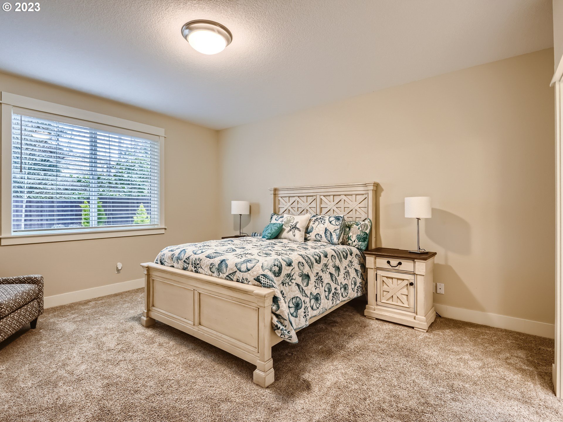11469 Southwest Gabriel Street Tigard, OR 97224 - Photo 16 of 25 a bed sitting in a bedroom next to a window