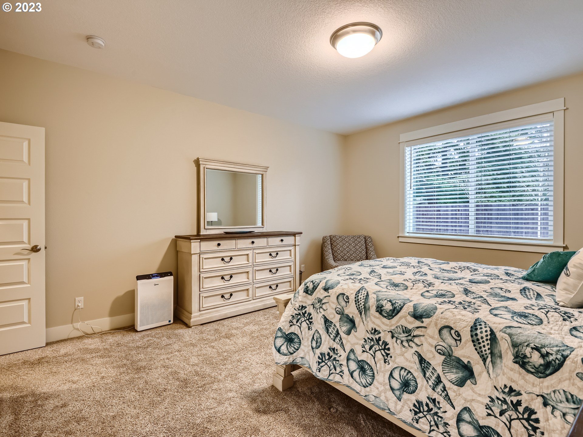 11469 Southwest Gabriel Street Tigard, OR 97224 - Photo 17 of 25 a bedroom with a bed and a cabinets