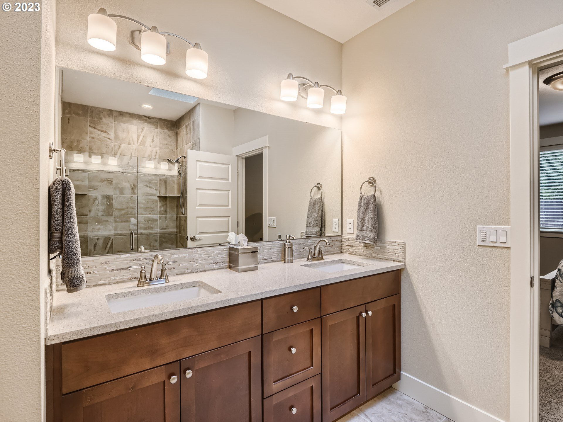 11469 Southwest Gabriel Street Tigard, OR 97224 - Photo 20 of 25 a bathroom with double sink and a mirror