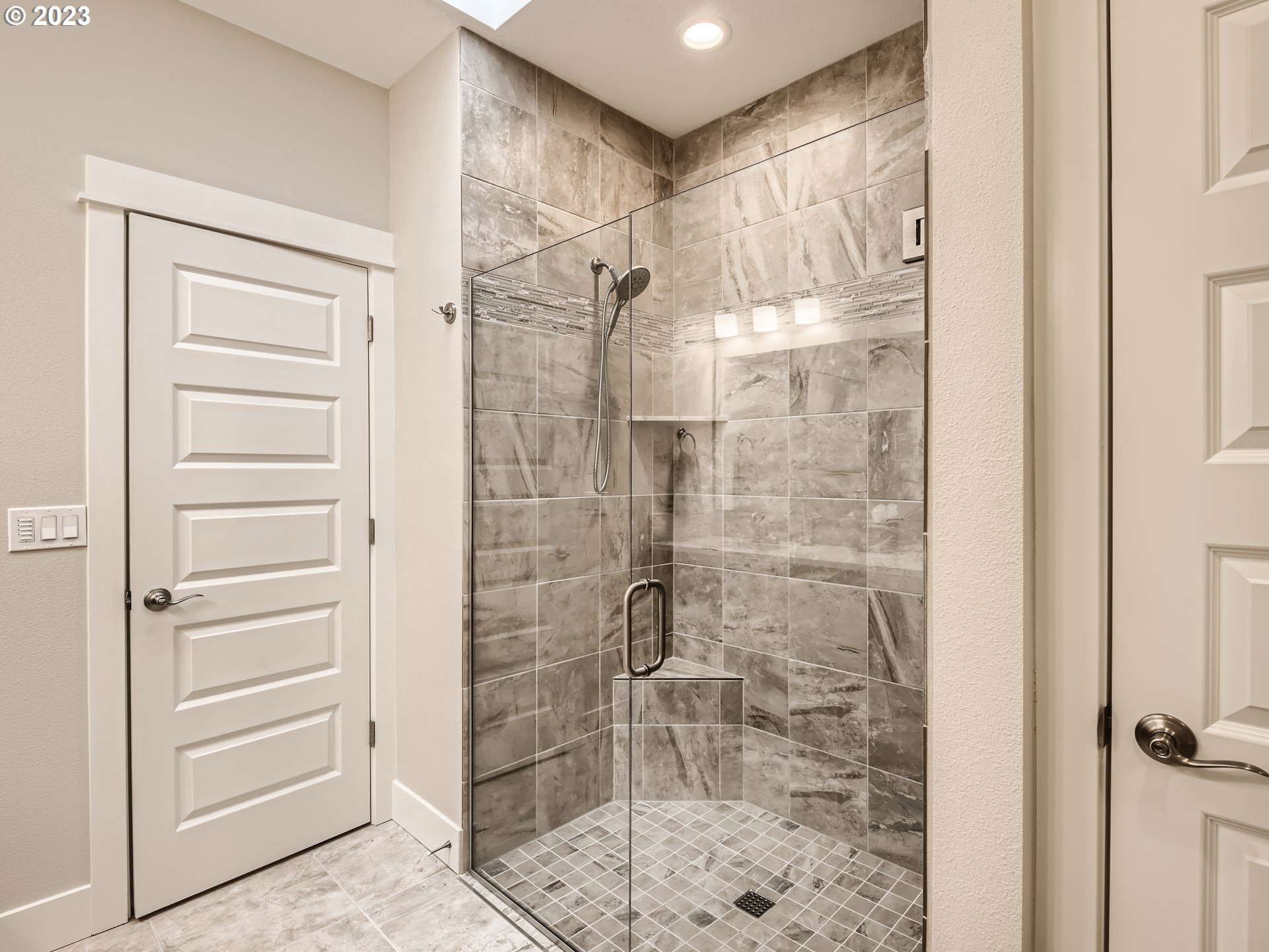 11469 Southwest Gabriel Street Tigard, OR 97224 - Photo 21 of 25 a bathroom with a glass door shower