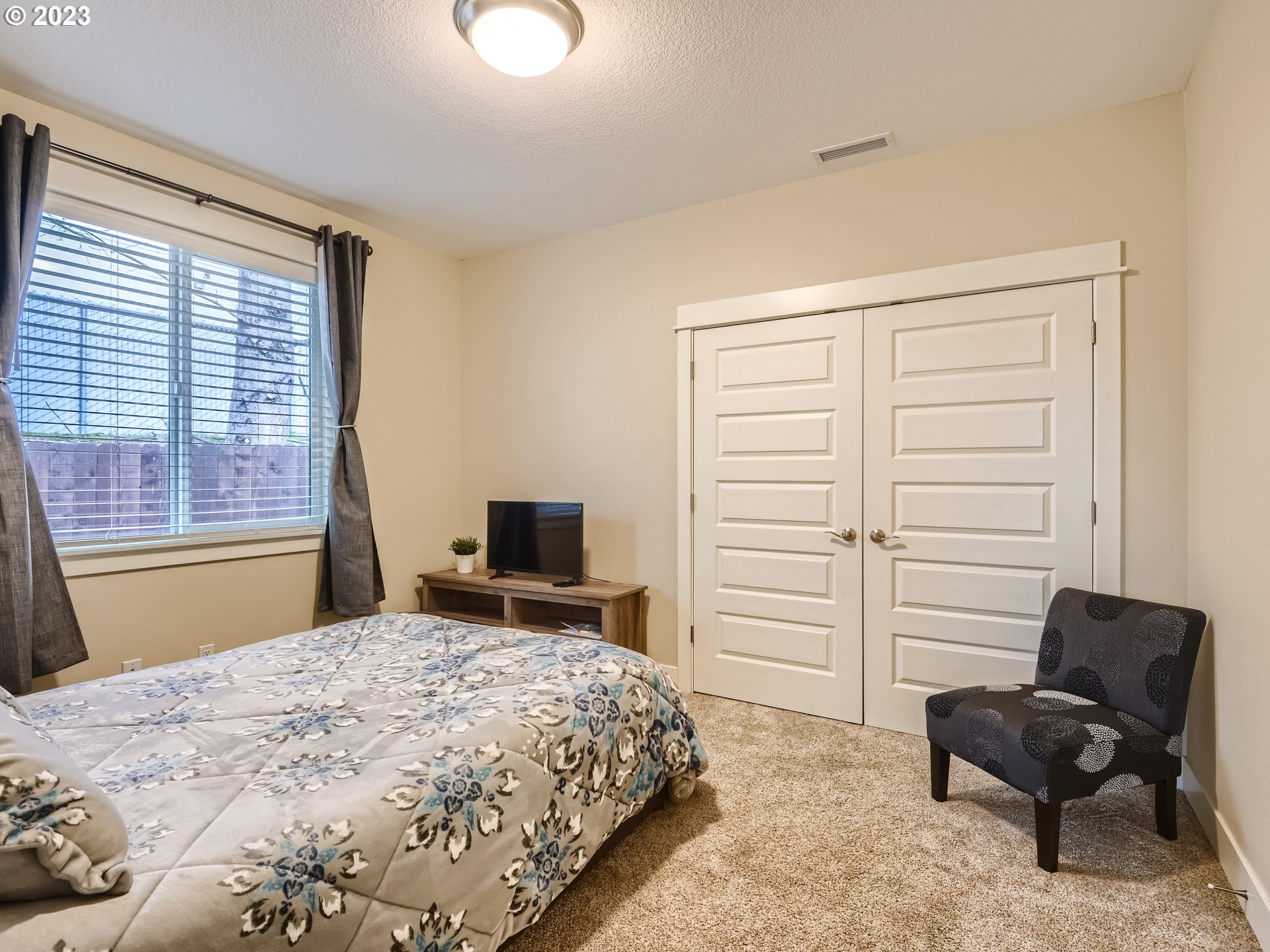 11469 Southwest Gabriel Street Tigard, OR 97224 - Photo 22 of 25 a bedroom with a bed and a chair