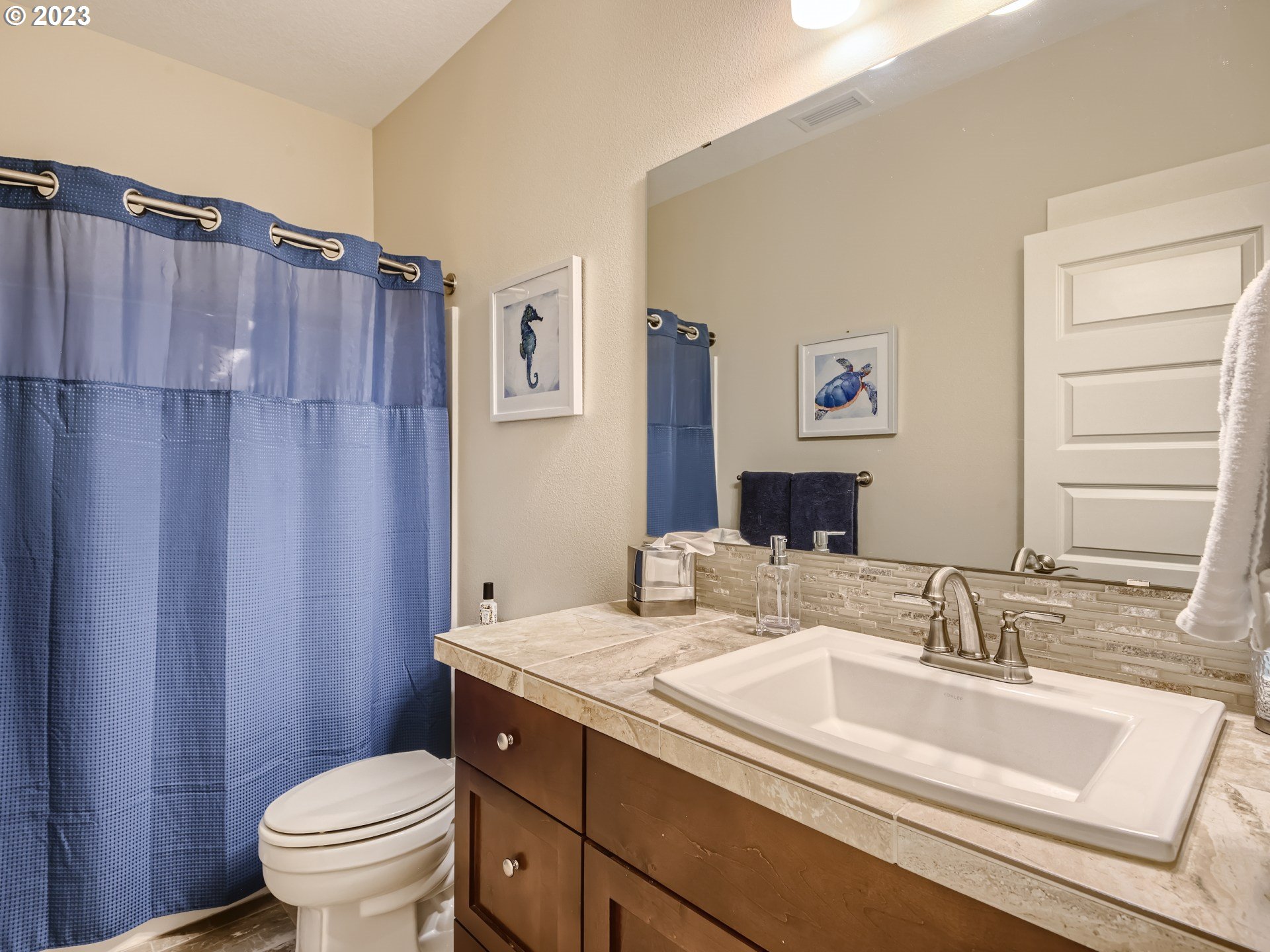 11469 Southwest Gabriel Street Tigard, OR 97224 - Photo 23 of 25 a bathroom with a granite countertop sink toilet and a mirror