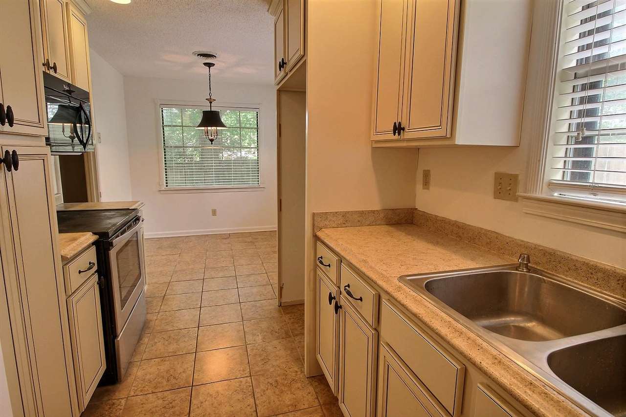 338 Rutledge Street Collierville, TN 38017 - Photo 6 of 19 Galley kitchen with nice cabinets