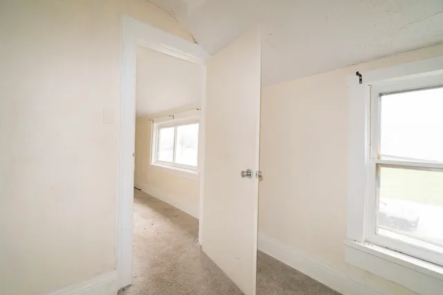 a room with window and furniture