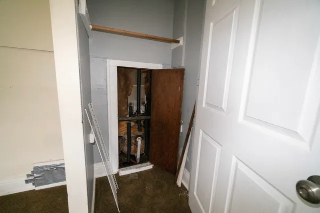 a view of staircase with white walls and stairs