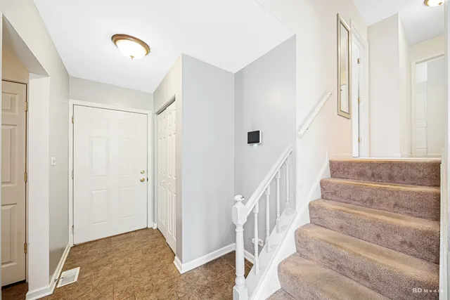 a bathroom with a sink mirror vanity and toilet