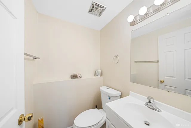 a yellow house in middle of the forest