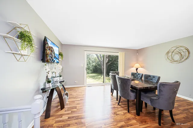 a view of a dining room with furniture window and outside view