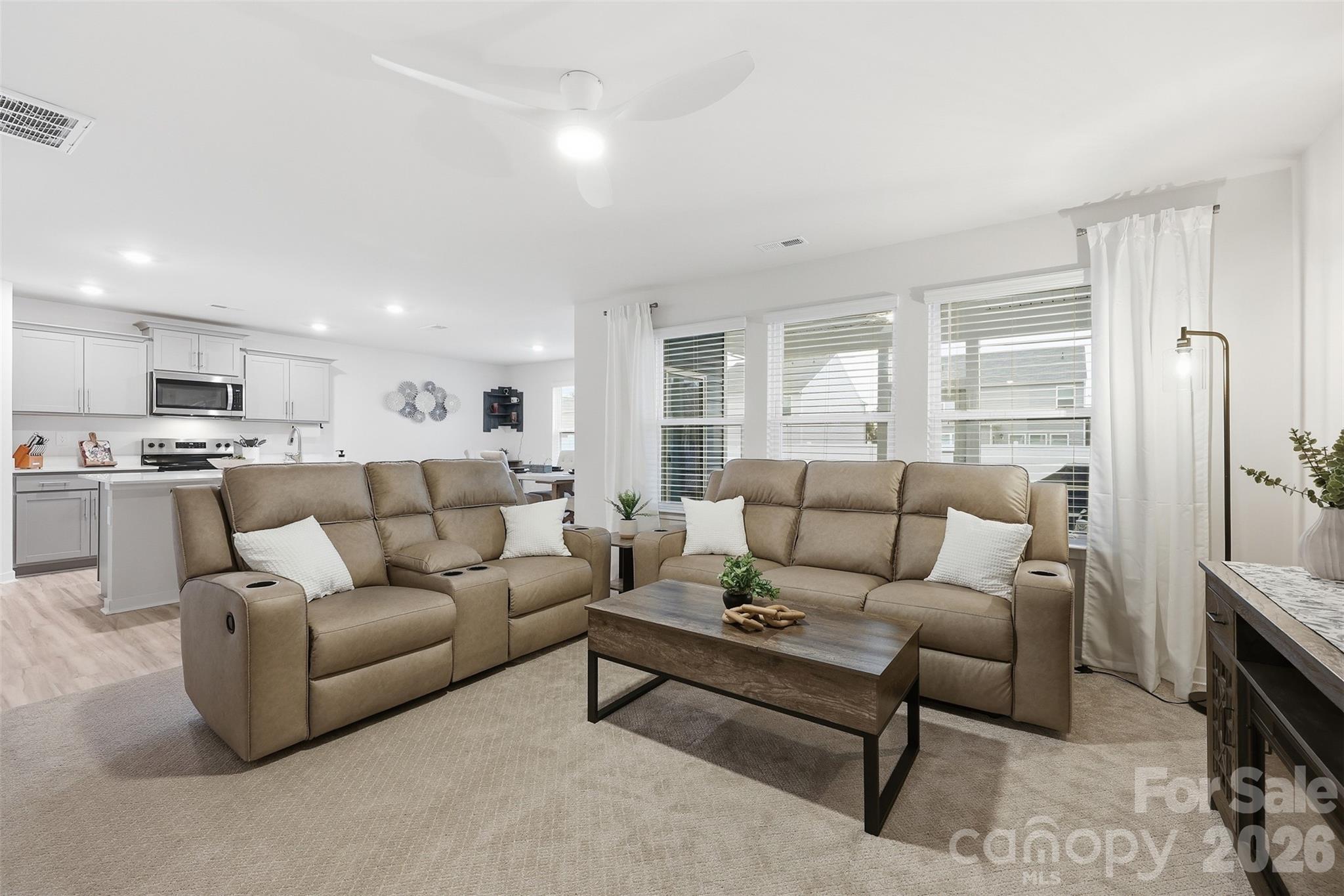 586 North Sparkleberry Street Chester, SC 29706 - Photo 11 of 36 a living room with furniture white walls and a fireplace