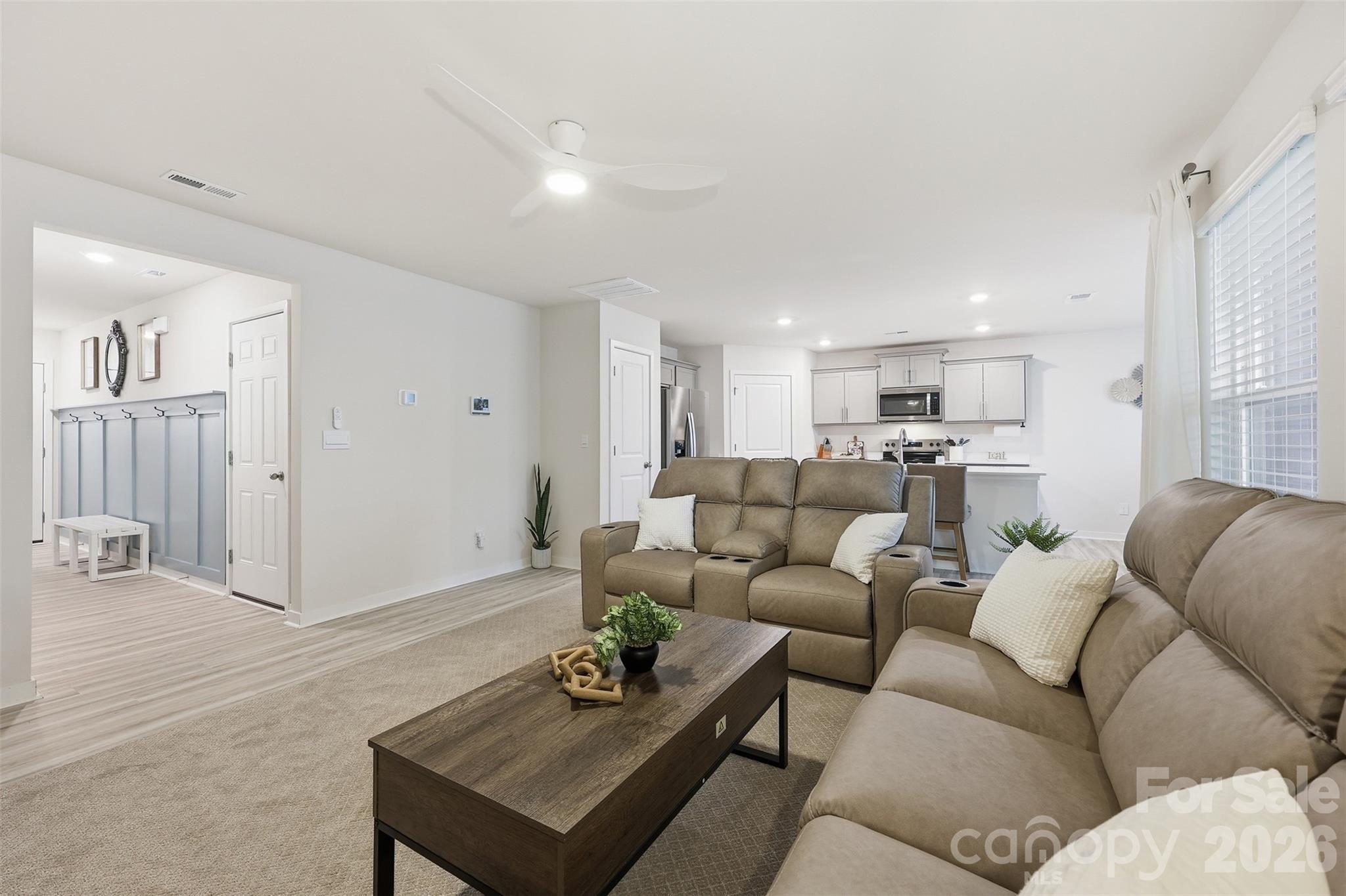 586 North Sparkleberry Street Chester, SC 29706 - Photo 12 of 36 a living room with furniture kitchen view and a wooden floor