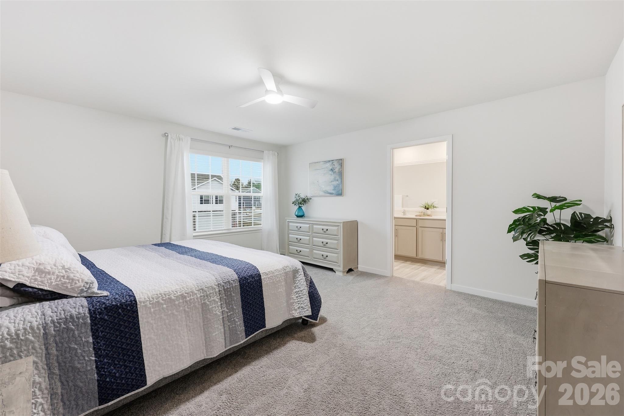 586 North Sparkleberry Street Chester, SC 29706 - Photo 17 of 36 a spacious bedroom with a bed and a potted plant