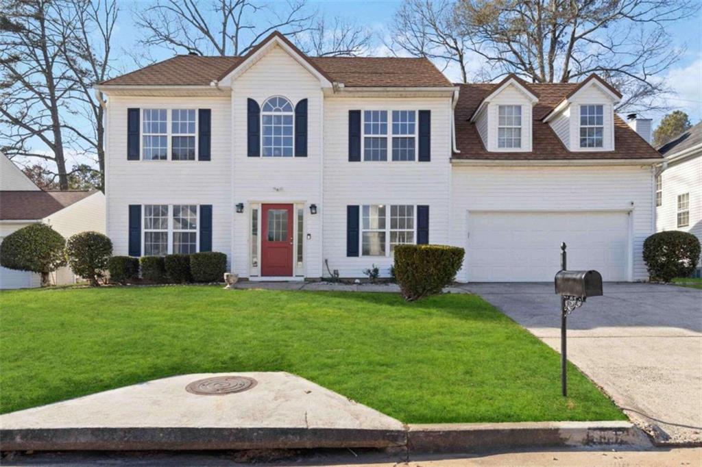 3557 Willow Tree Trace Decatur, GA 30034 - Photo 1 of 1 a view of a white house with a yard plants and a table and chairs
