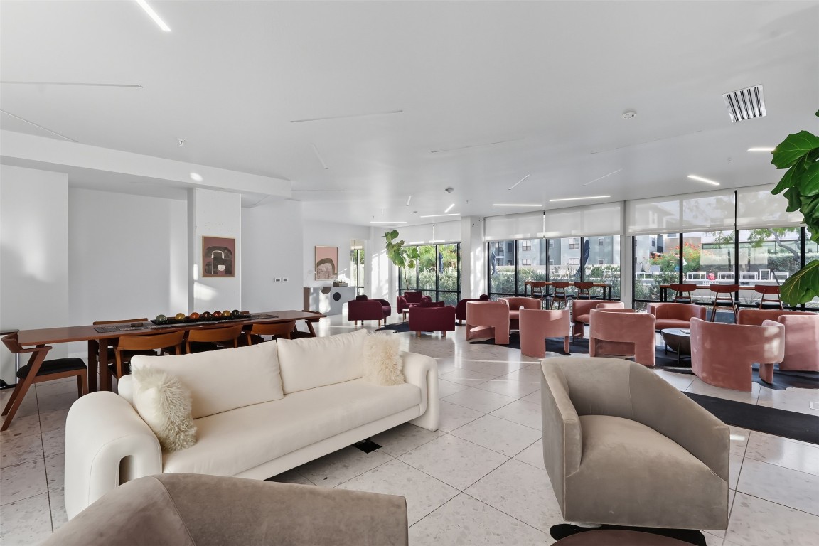 800 Embassy Drive, Unit 320 Austin, TX 78702 - Photo 20 of 23 a living room with furniture and a large window