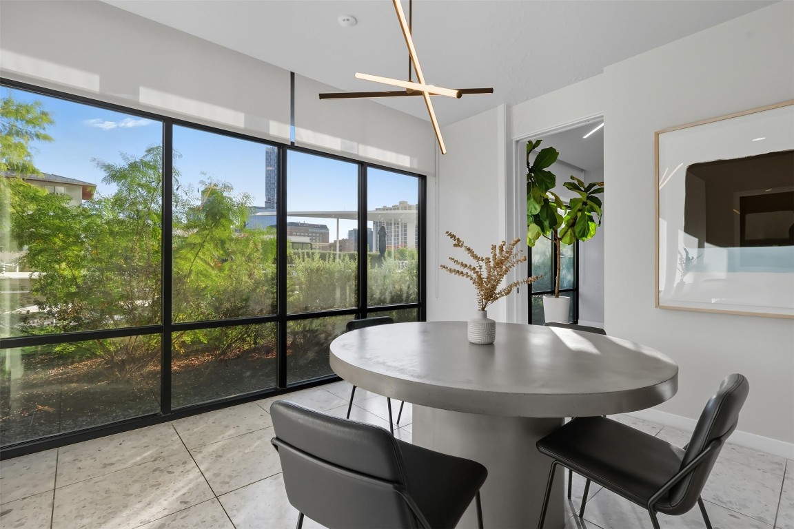 800 Embassy Drive, Unit 320 Austin, TX 78702 - Photo 21 of 23 a dining room with furniture and window