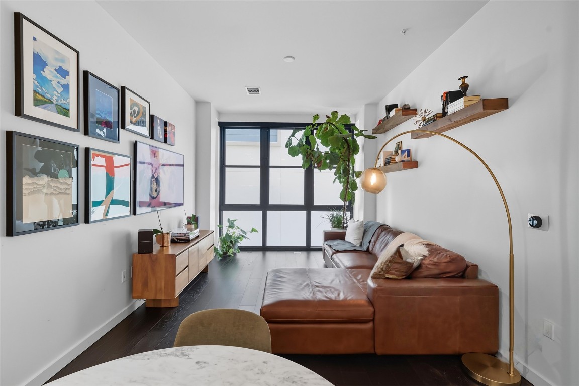 800 Embassy Drive, Unit 320 Austin, TX 78702 - Photo 5 of 23 a living room with furniture and a potted plant
