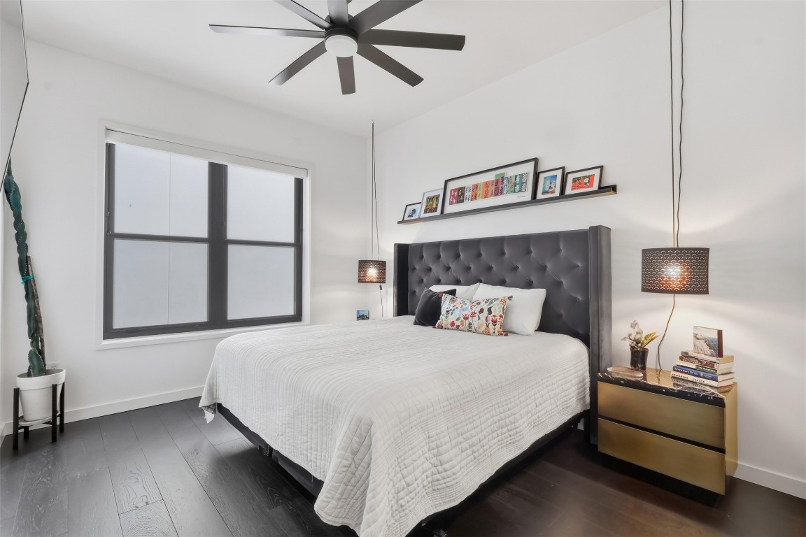 800 Embassy Drive, Unit 320 Austin, TX 78702 - Photo 6 of 23 a bedroom with a large bed and a window