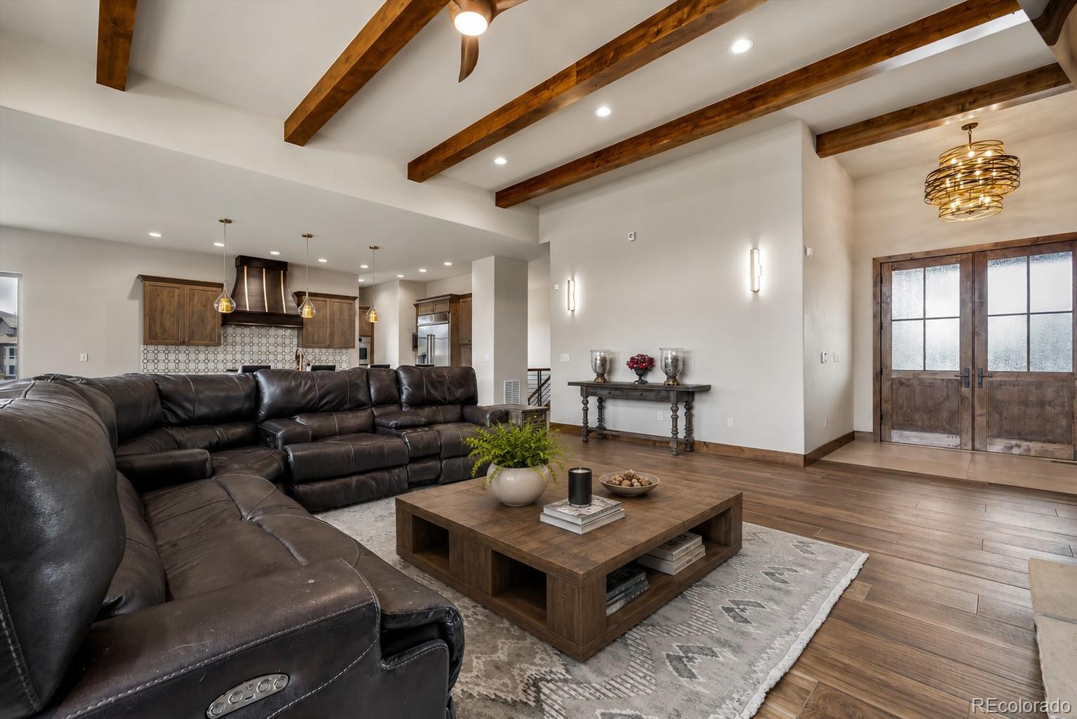 5754 Powell Road Parker, CO 80134 - Photo 7 of 43 a living room with furniture and a table
