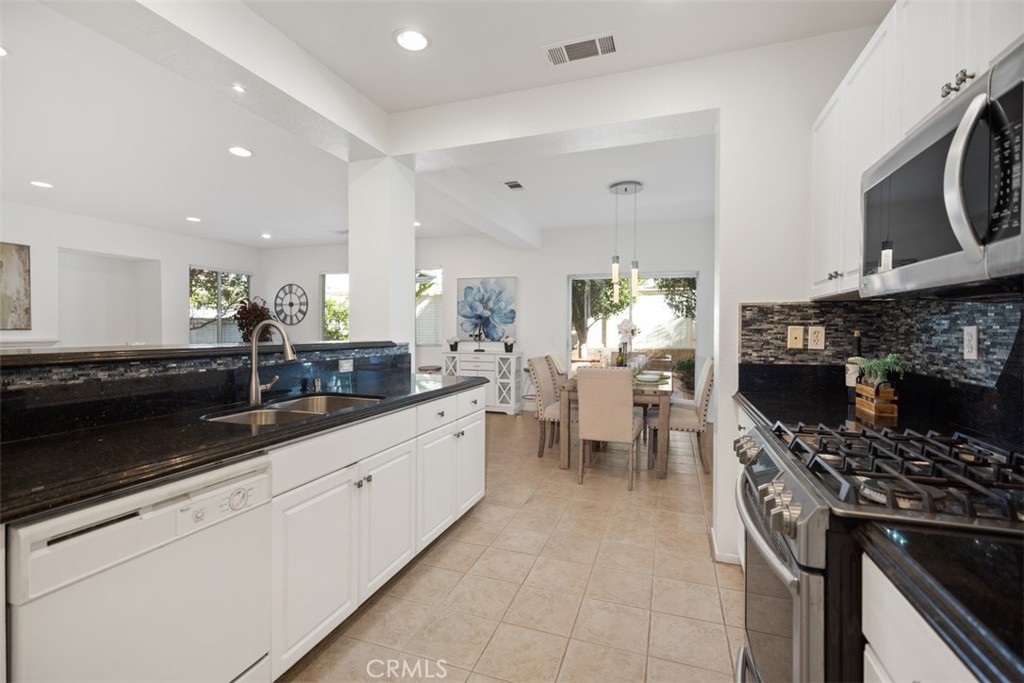 39 Ohio Irvine, CA 92606 - Photo 16 of 46 a kitchen with lots of counter top space and stainless steel appliances