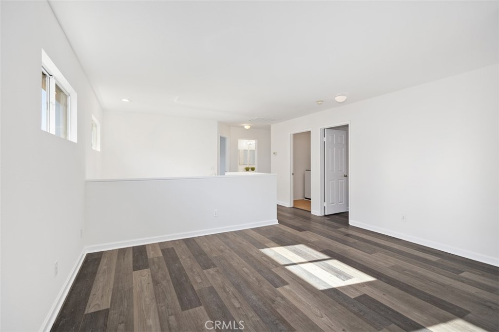 39 Ohio Irvine, CA 92606 - Photo 26 of 46 an empty room with wooden floor and windows