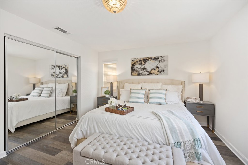 39 Ohio Irvine, CA 92606 - Photo 28 of 46 a bedroom with a large bed and a painting on the wall