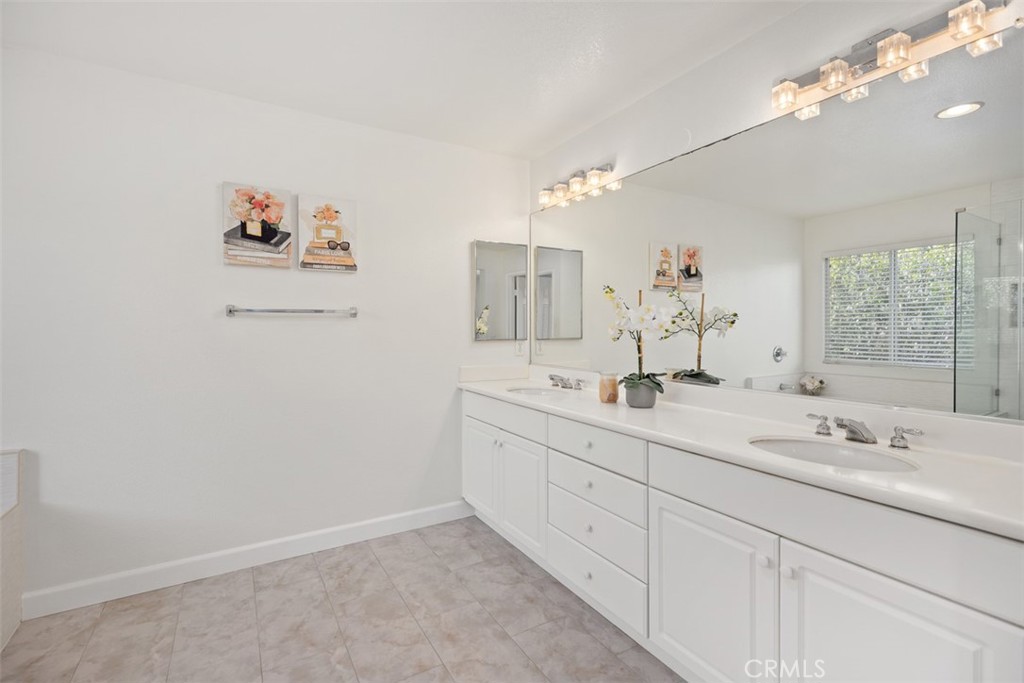 39 Ohio Irvine, CA 92606 - Photo 29 of 46 a bathroom with a double vanity sink and a mirror