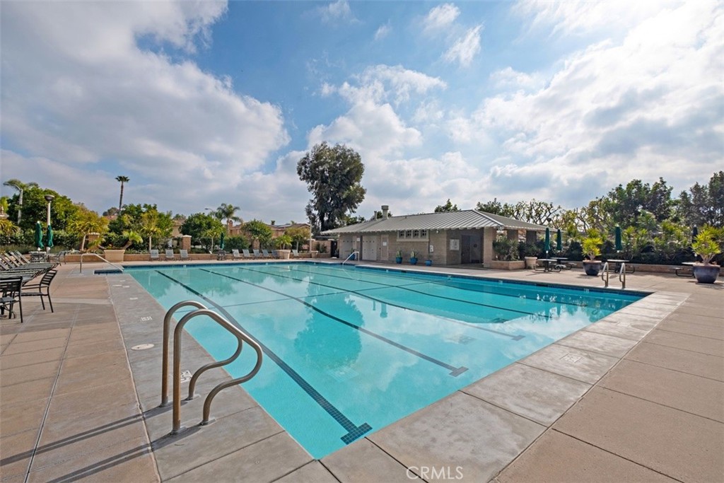 39 Ohio Irvine, CA 92606 - Photo 40 of 46 a view of swimming pool with outdoor seating and city in the background