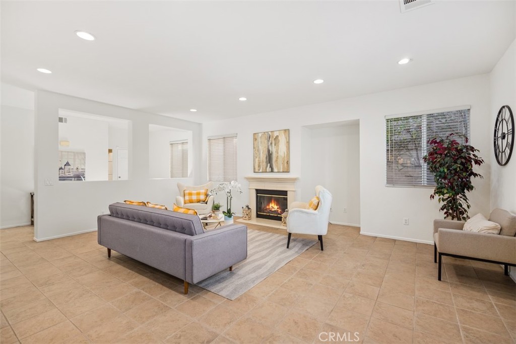 39 Ohio Irvine, CA 92606 - Photo 5 of 46 a living room with furniture flower pot and a fireplace