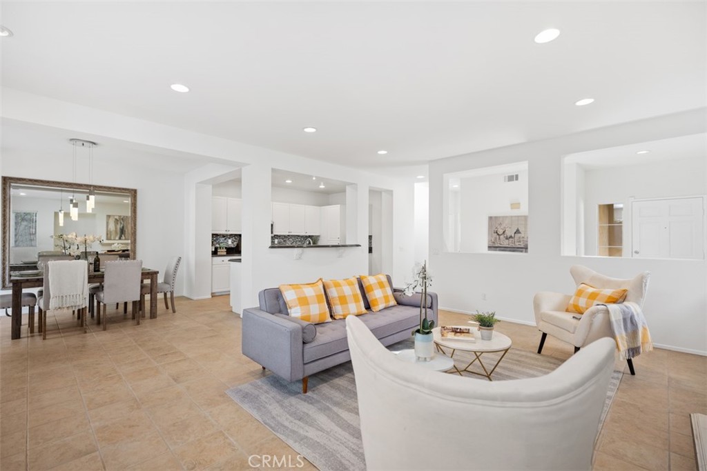 39 Ohio Irvine, CA 92606 - Photo 7 of 46 a living room with furniture and a dining table with kitchen view