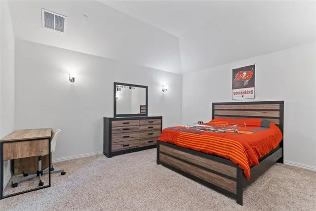 a bedroom with a bed and furniture