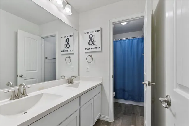 a bedroom with furniture and a gym machine